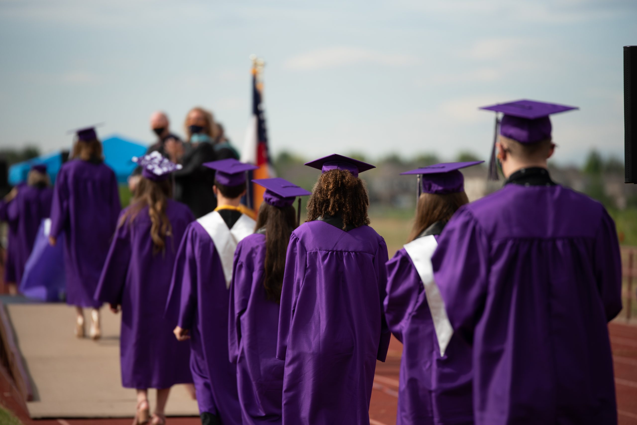 Graduates lined up preparing to cross the stage